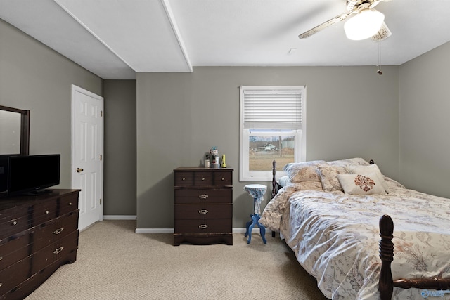 bedroom featuring light carpet and ceiling fan