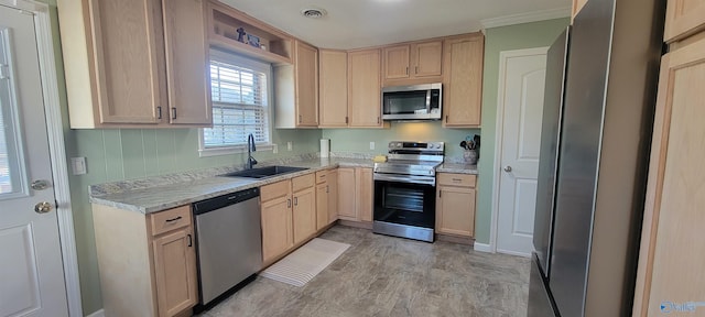 kitchen with visible vents, light brown cabinets, appliances with stainless steel finishes, and a sink