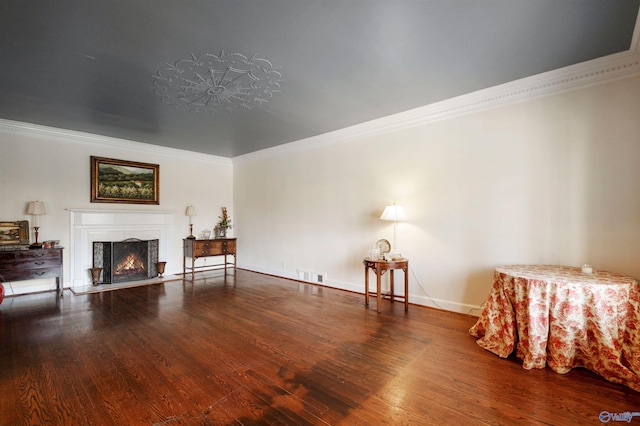 living room featuring ornamental molding and hardwood / wood-style floors