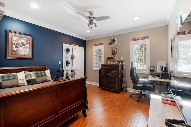 bedroom featuring crown molding, hardwood / wood-style floors, and ceiling fan