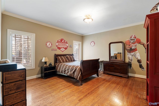 bedroom with ornamental molding and hardwood / wood-style floors