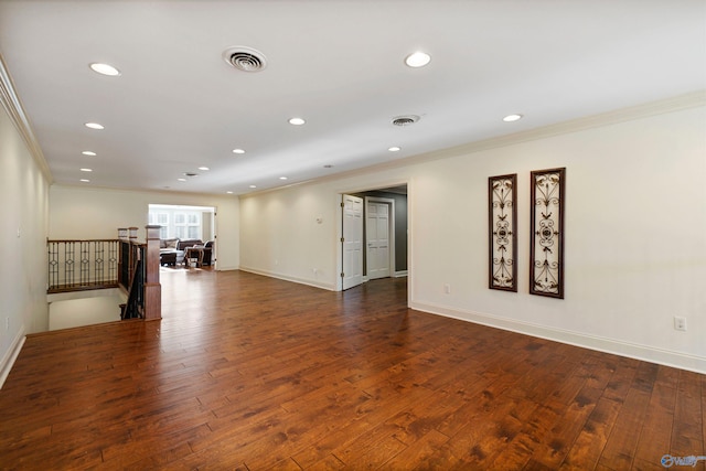 interior space featuring crown molding and hardwood / wood-style floors