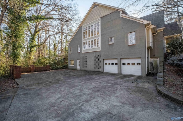 view of property exterior featuring a garage