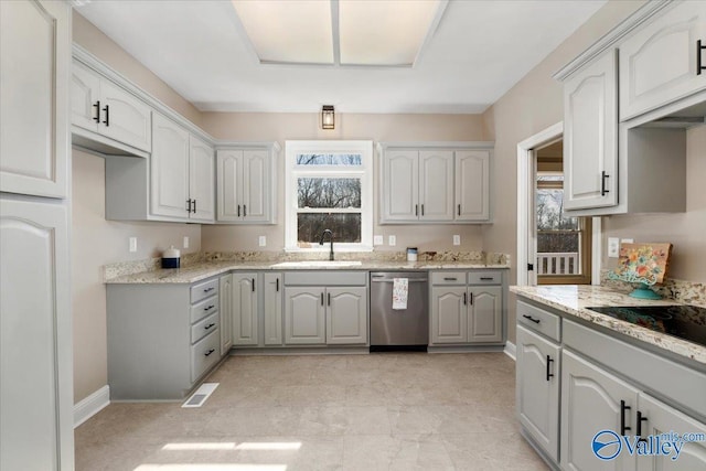 kitchen with plenty of natural light, dishwasher, sink, and gray cabinetry