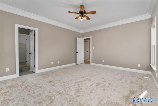 unfurnished bedroom with light carpet, crown molding, and ceiling fan