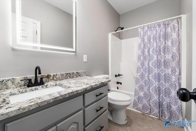 full bathroom with vanity, tile patterned flooring, toilet, and shower / bath combo with shower curtain