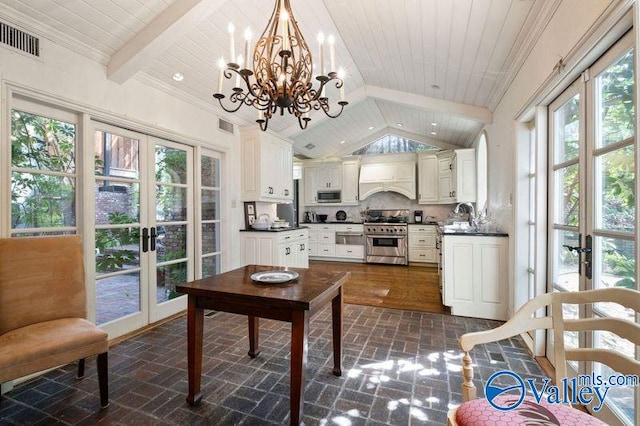 office area featuring beamed ceiling, sink, french doors, dark wood-type flooring, and a notable chandelier