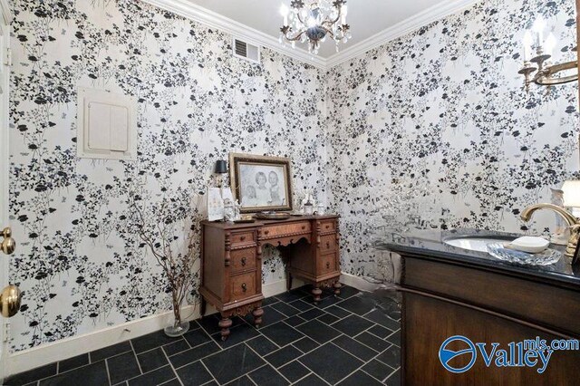 bathroom with an inviting chandelier, vanity, tile patterned flooring, and ornamental molding