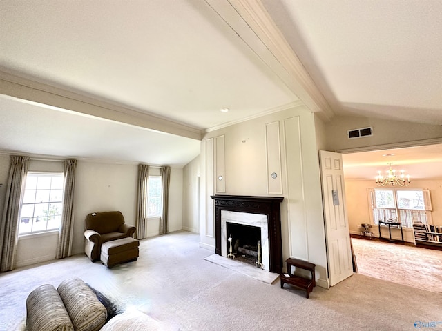 living area featuring lofted ceiling with beams, carpet, and a chandelier