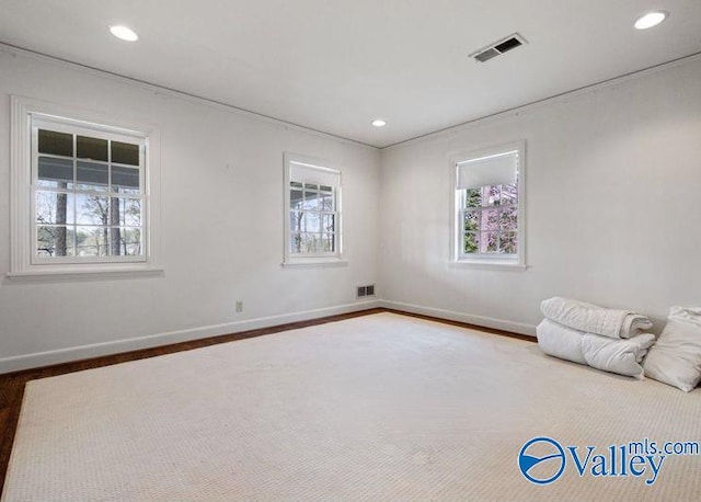 unfurnished bedroom with recessed lighting, visible vents, and baseboards