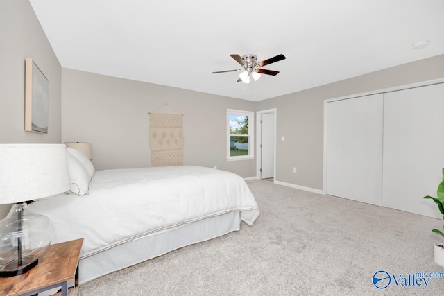 bedroom with ceiling fan, a closet, and carpet