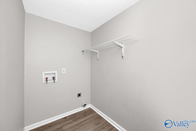 laundry room featuring washer hookup, hookup for an electric dryer, and dark wood-type flooring