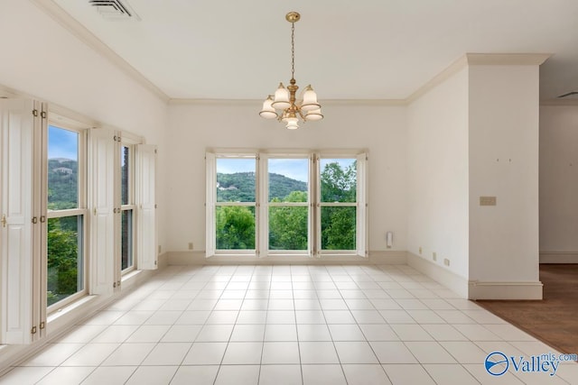 unfurnished dining area featuring an inviting chandelier, visible vents, crown molding, and baseboards