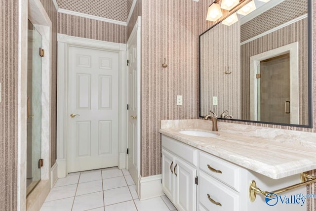 full bathroom with a shower stall, wallpapered walls, baseboards, vanity, and tile patterned flooring
