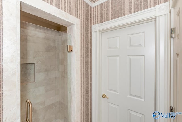 full bath featuring wallpapered walls and a stall shower