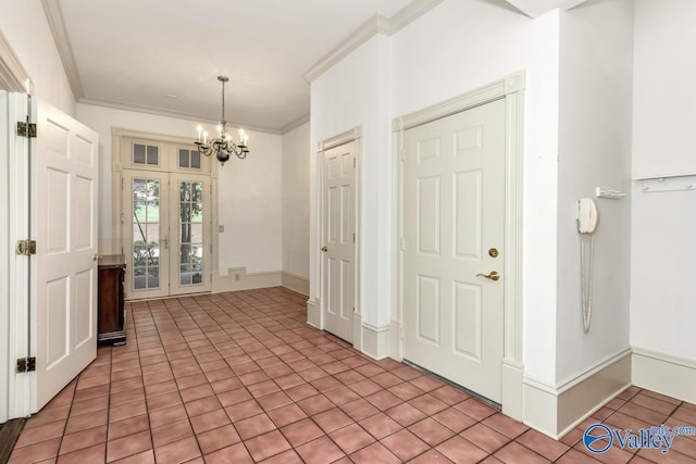 entryway with light tile patterned flooring, ornamental molding, french doors, and a notable chandelier