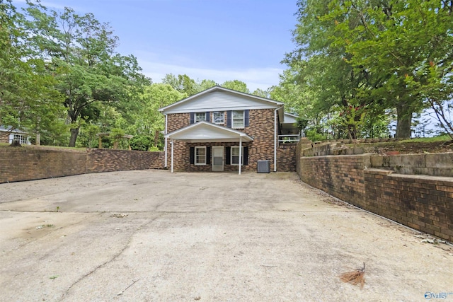 1025 Berkley Rd, Arab, AL 35016 - view of front of house with stone siding, concrete driveway, and a porch