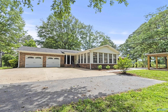 1025 Berkley Rd, Arab, AL 35016 - view of front of house with a garage, brick siding, and concrete driveway