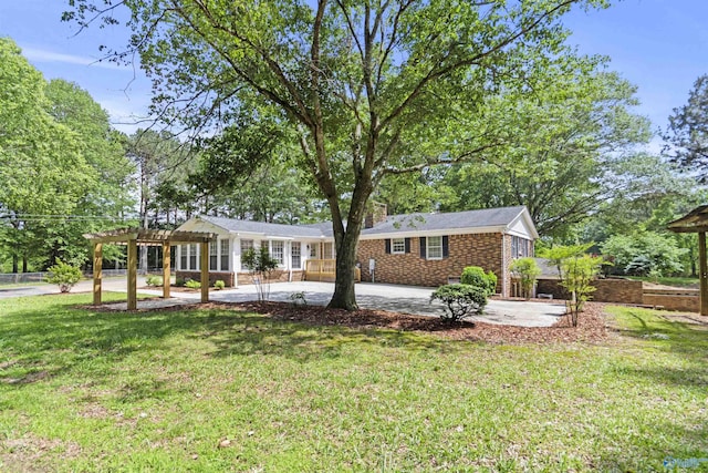 1025 Berkley Rd, Arab, AL 35016 - ranch-style house featuring a pergola, a front yard, a patio area, and a chimney