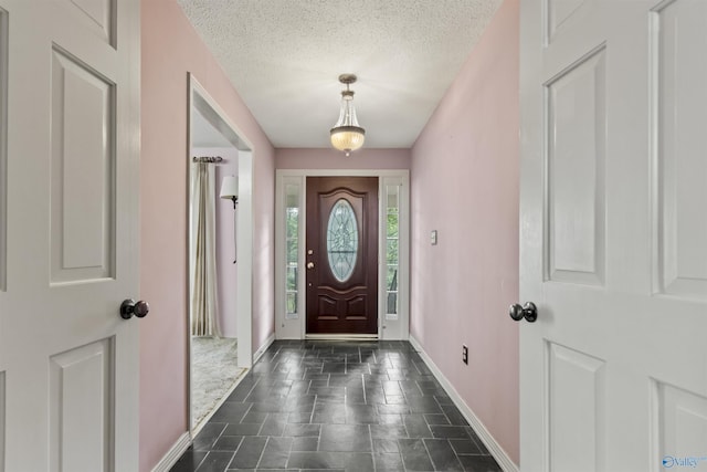 1025 Berkley Rd, Arab, AL 35016 - foyer entrance with a textured ceiling and baseboards