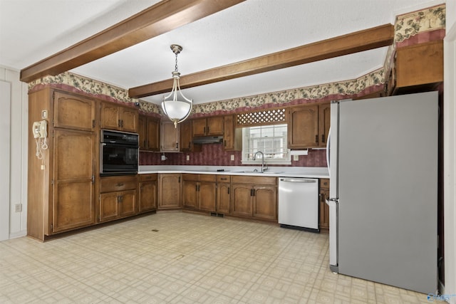 1025 Berkley Rd, Arab, AL 35016 - kitchen featuring freestanding refrigerator, stainless steel dishwasher, black oven, a sink, and beam ceiling