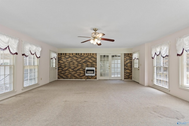 1025 Berkley Rd, Arab, AL 35016 - unfurnished living room featuring heating unit, healthy amount of natural light, and carpet floors