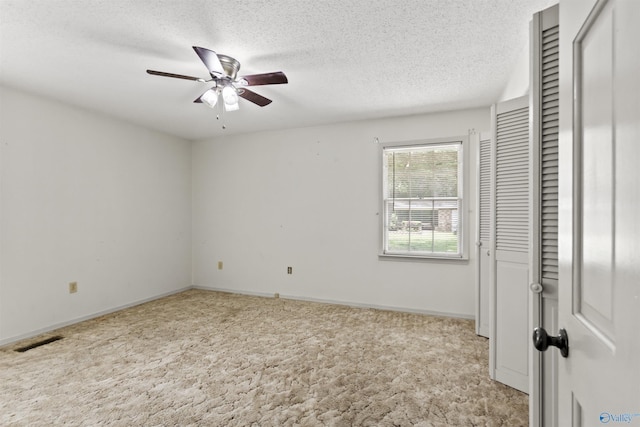 1025 Berkley Rd, Arab, AL 35016 - unfurnished bedroom featuring carpet floors, a textured ceiling, baseboards, and a ceiling fan