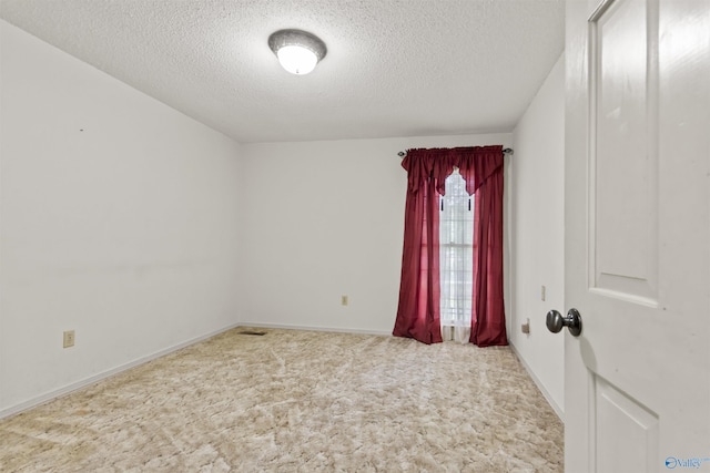 1025 Berkley Rd, Arab, AL 35016 - carpeted spare room featuring a textured ceiling and baseboards