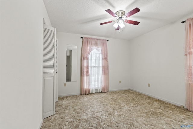 1025 Berkley Rd, Arab, AL 35016 - unfurnished bedroom featuring carpet floors, baseboards, a textured ceiling, and a ceiling fan