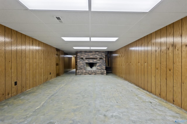 1025 Berkley Rd, Arab, AL 35016 - finished basement with a fireplace, wood walls, and a paneled ceiling