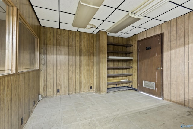 1025 Berkley Rd, Arab, AL 35016 - spare room with wooden walls and a drop ceiling