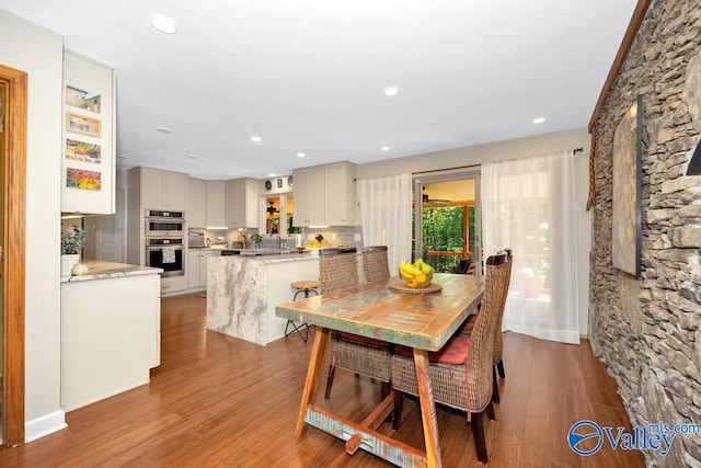 dining room with light hardwood / wood-style flooring