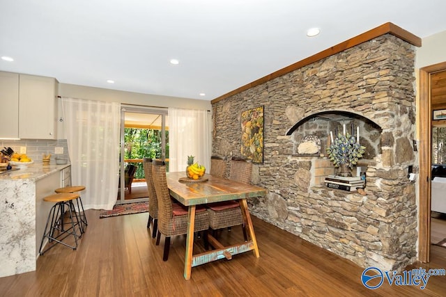 dining room with wood-type flooring