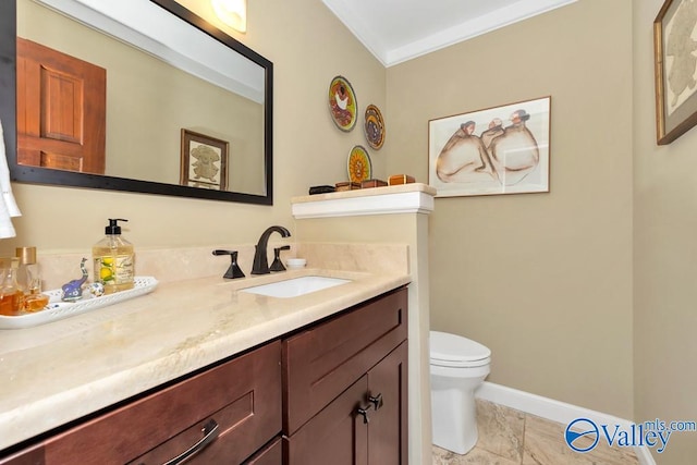 bathroom with tile patterned floors, vanity, crown molding, and toilet