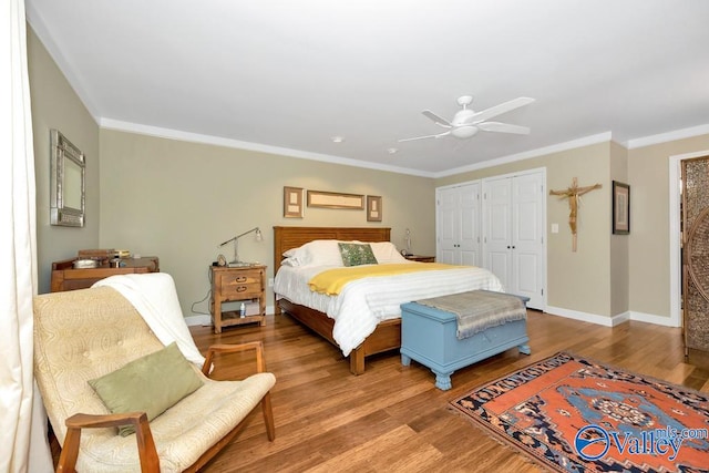 bedroom with ceiling fan, hardwood / wood-style flooring, and ornamental molding