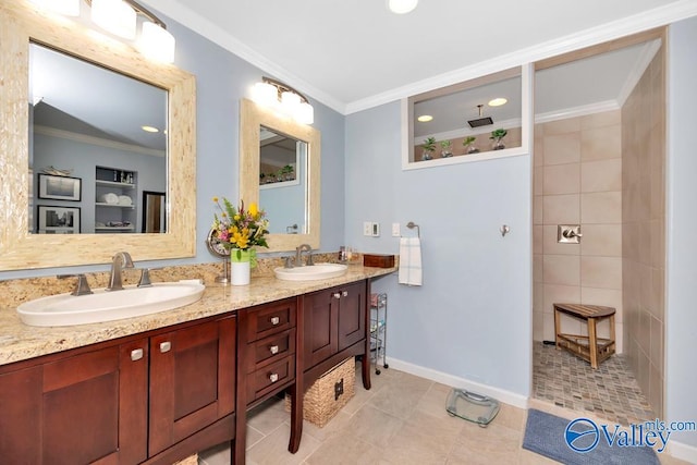 bathroom with dual vanity, ornamental molding, tile patterned floors, and tile walls