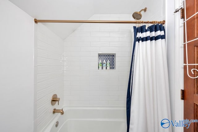 bathroom featuring shower / tub combo with curtain