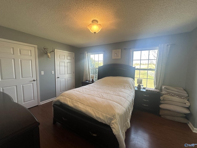 2415 Ruth Rd, Arab, AL 35016 - bedroom with baseboards, a textured ceiling, and wood finished floors