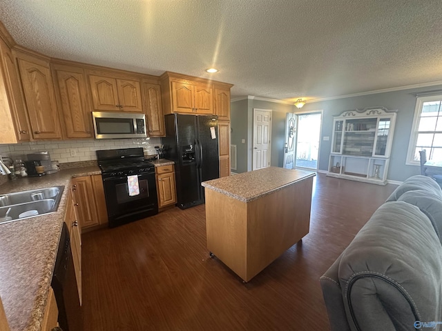 2415 Ruth Rd, Arab, AL 35016 - kitchen with dark wood finished floors, a sink, black appliances, crown molding, and open floor plan