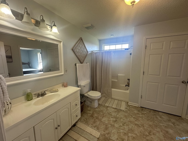 2415 Ruth Rd, Arab, AL 35016 - bathroom with visible vents, toilet, vanity, a textured ceiling, and shower / bathtub combination with curtain