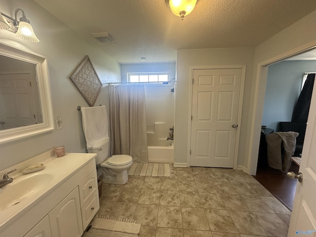 2415 Ruth Rd, Arab, AL 35016 - full bath featuring vanity, visible vents, shower / bath combination with curtain, a textured ceiling, and toilet
