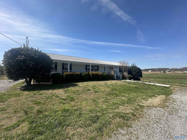 2415 Ruth Rd, Arab, AL 35016 - ranch-style home with a porch, metal roof, and a front lawn