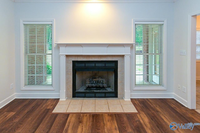 300 Honor Way, Madison, AL 35758 - detailed view of wood finished floors, baseboards, and a fireplace