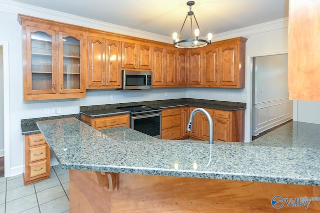 300 Honor Way, Madison, AL 35758 - kitchen featuring appliances with stainless steel finishes, brown cabinets, dark stone counters, glass insert cabinets, and ornamental molding