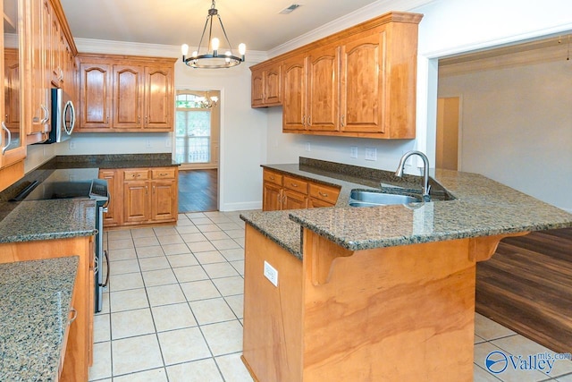 300 Honor Way, Madison, AL 35758 - kitchen with appliances with stainless steel finishes, light tile patterned floors, a peninsula, a chandelier, and ornamental molding