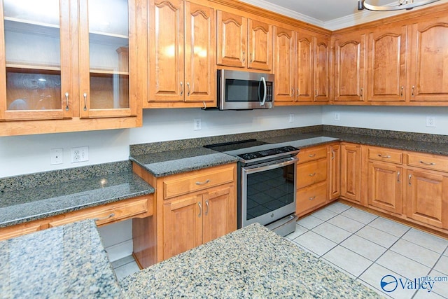 300 Honor Way, Madison, AL 35758 - kitchen with stainless steel appliances, light tile patterned floors, glass insert cabinets, dark stone counters, and ornamental molding