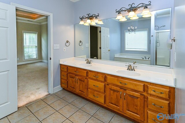 300 Honor Way, Madison, AL 35758 - bathroom with a chandelier, a bath, double vanity, a stall shower, and crown molding
