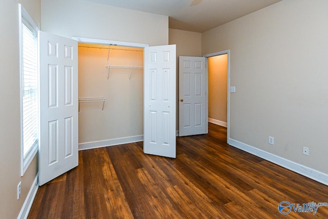 300 Honor Way, Madison, AL 35758 - unfurnished bedroom featuring wood finished floors, baseboards, and a closet