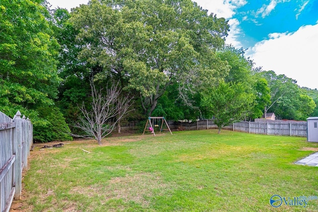 300 Honor Way, Madison, AL 35758 - view of yard featuring a playground and a storage unit