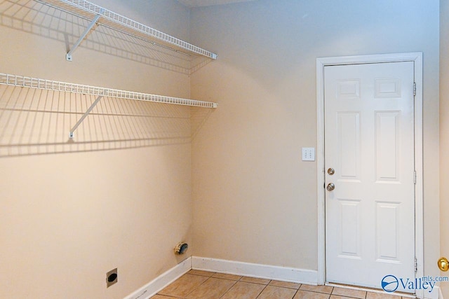 300 Honor Way, Madison, AL 35758 - washroom with light tile patterned floors, hookup for an electric dryer, and baseboards